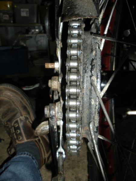 See the damage to the sprocket on the left, and the incorrect alignment.