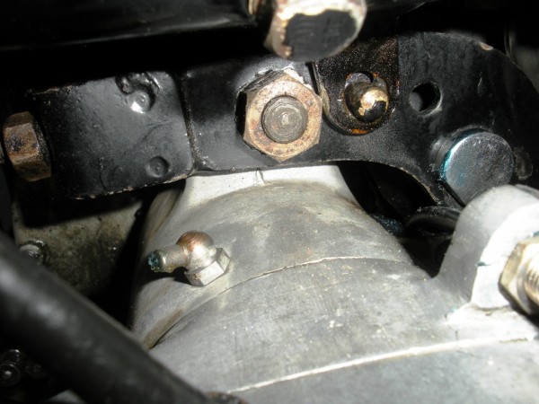 Two nuts here. Centre is main lock nut. Left is the adjuster.<br />Yes, I know the oil tank nut is missing!